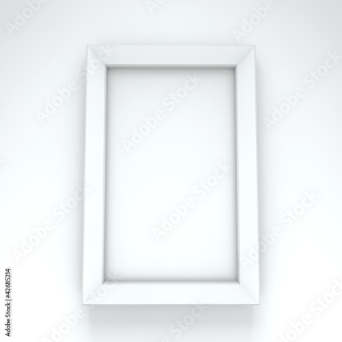 Blank white frame hanging on white wall.