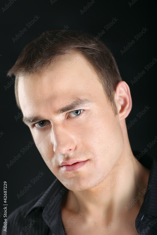 A portrait of a man isolated on black background A portrait of a man isolated on black background