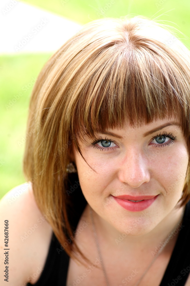 Closeup portrait of a happy young woman