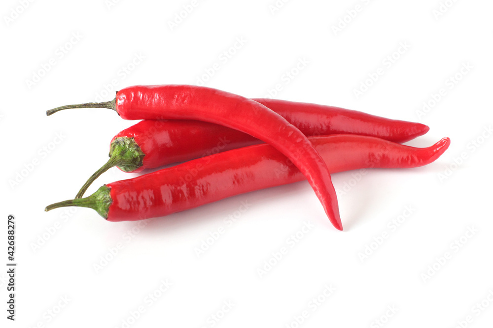 three red chili peppers isolated on white