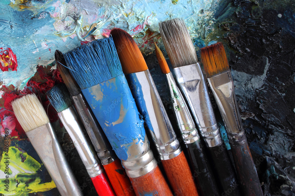 closeup of dirty brushes on palette closeup of dirty brushes on palette