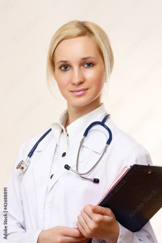 A female doctor with a folder , isolated on white background A female doctor with a folder , isolated on white background