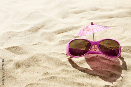sunglasses on beach in sand holiday hot day concept