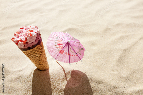 ice cream on beach in sand concept of hot day