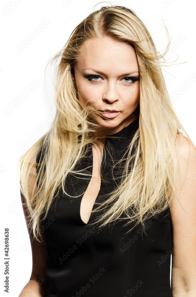Blond in black looks sexy with streaming hair Blond in black looks sexy with streaming hair