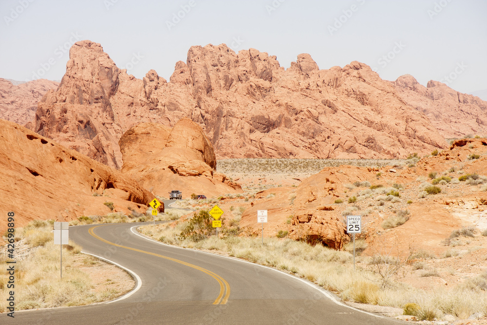 Truck on Curving Road Through Desert Truck on Curving Road Through Desert