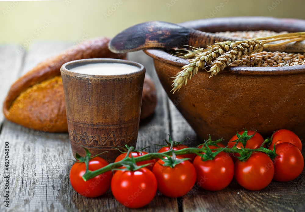 Composition of milk on the bread, the old background Composition of milk on the bread, the old background