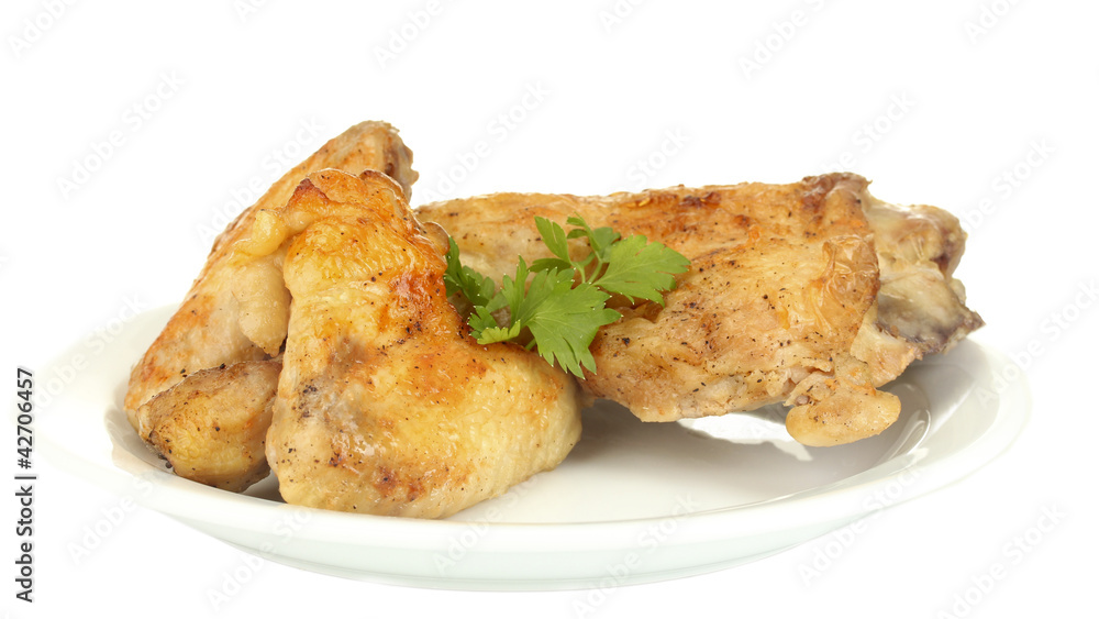 roasted chicken wings and leg with parsley in the plate roasted chicken wings and leg with parsley in the plate