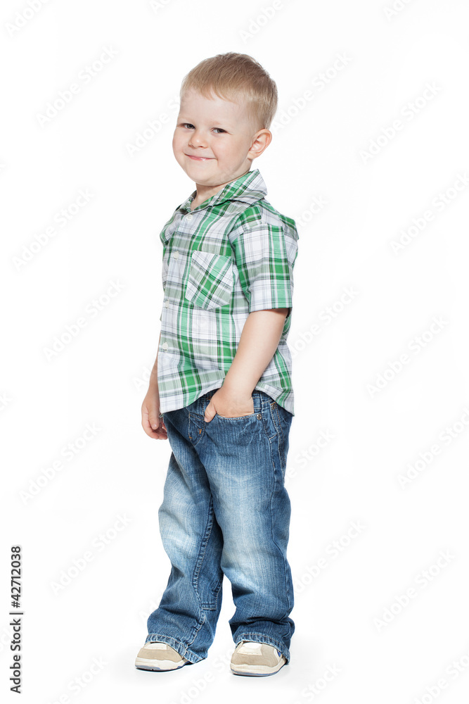 Adorable smiling little boy looks at the viewer Adorable smiling little boy looks at the viewer