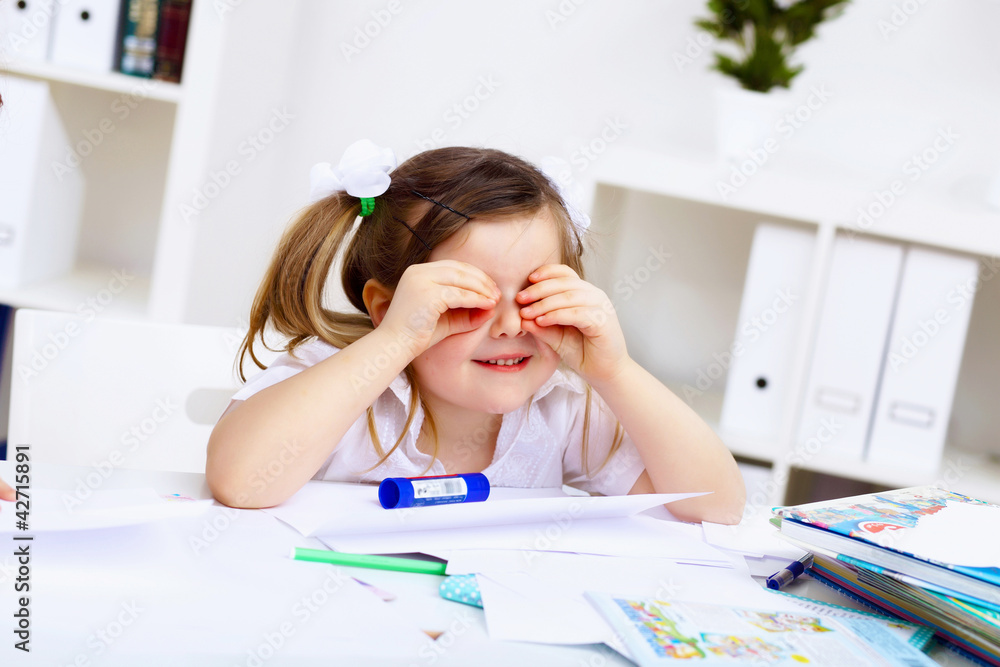 Little girl and her mother studying Little girl and her mother studying