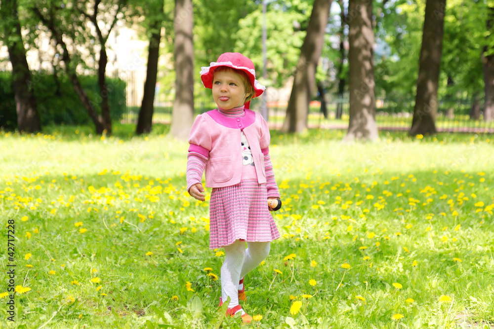small girl showing her tongue outside small girl showing her tongue outside