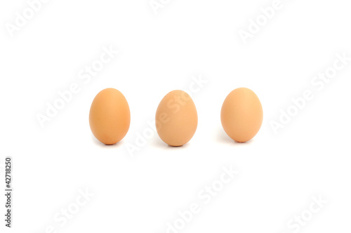 three eggs on white background