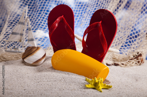 Flip flops on the beach, suntan