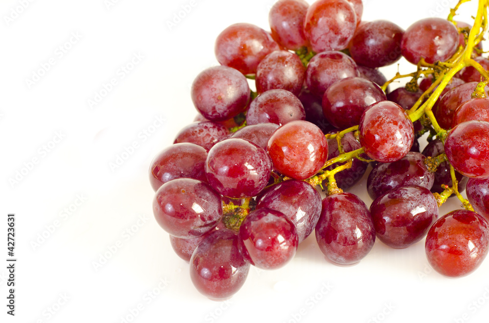 Close up of red grapes on white background Close up of red grapes on white background