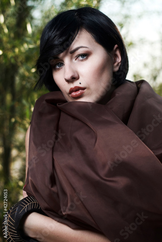 girl posing in a tree shade