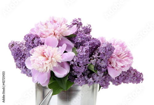 beautiful lilac and peonies flowers in metal bucket isolated