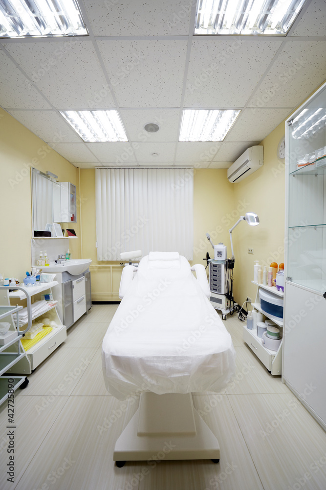 Cosmetic couch and other equipment in cabinet in beauty salon Cosmetic couch and other equipment in cabinet in beauty salon