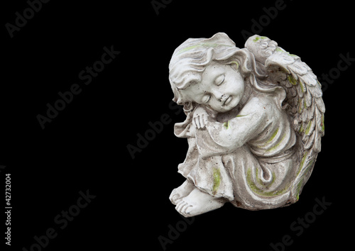 Statue of mourning angel isolated on black