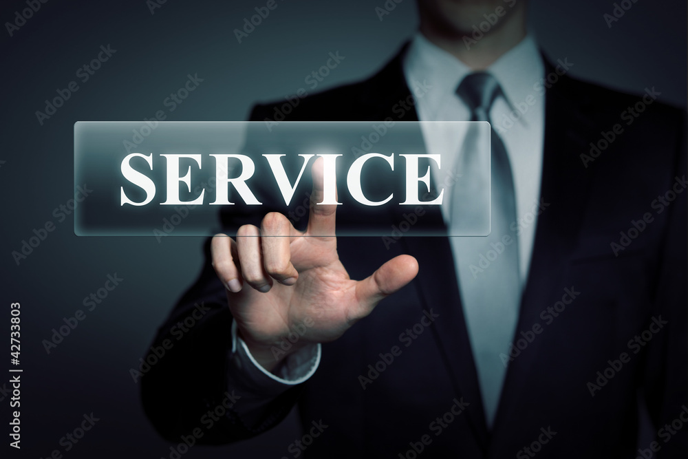 businessman touching virtual SERVICE button businessman touching virtual SERVICE button