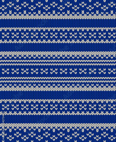 Knit texture. Blue seamless background with white ornament