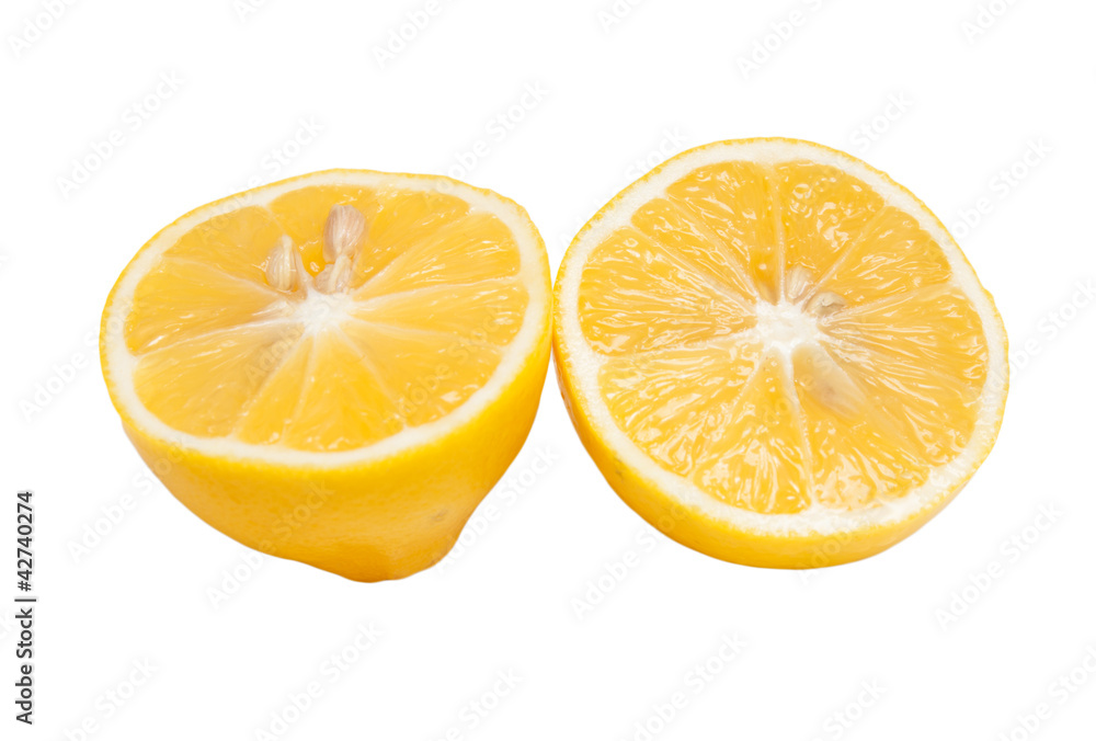 Half of a lemon with one slice isolated on white background