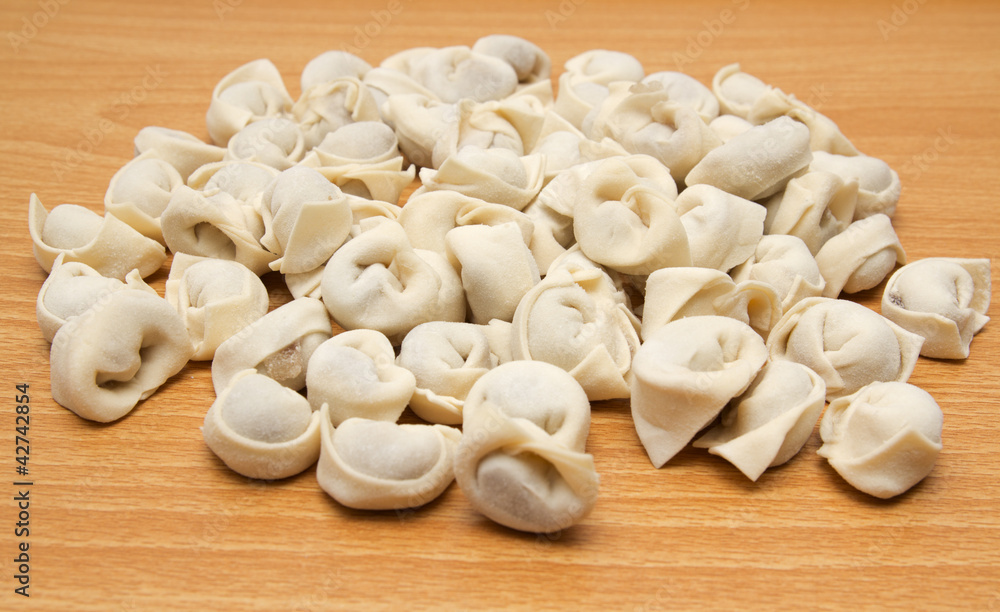homemade meat dumplings on a cutting board homemade meat dumplings on a cutting board