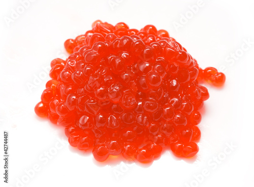Red salmon caviar heap isolated on white