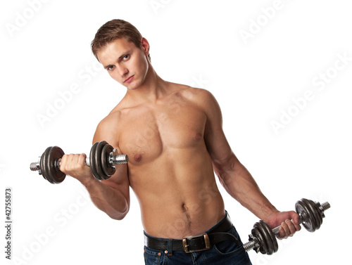 Muscular young man lifting weights over white