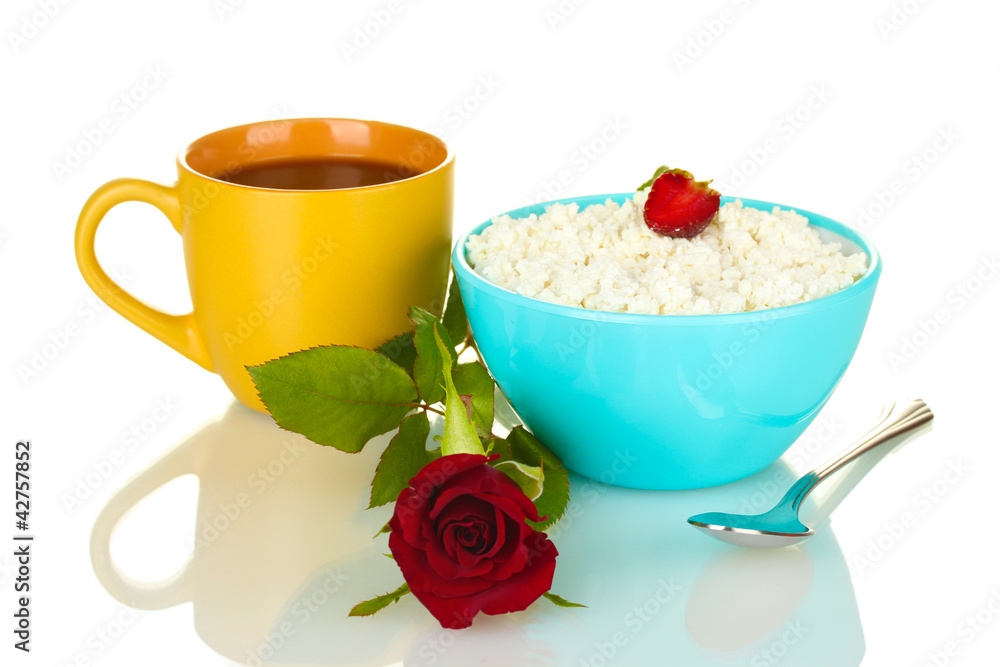 cottage cheese with strawberry in blue bowl and orange cup with