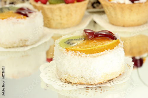 sweet cakes with fruits isolated on white
