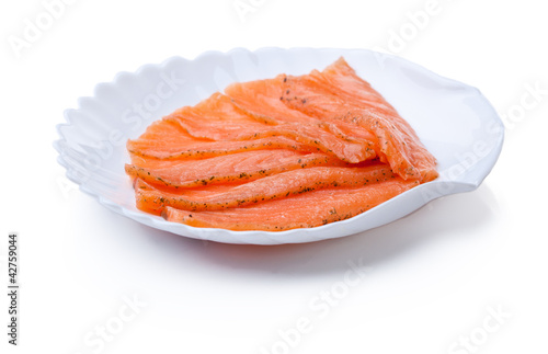 Sliced red fish on plate