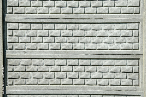 fence from a gray brick