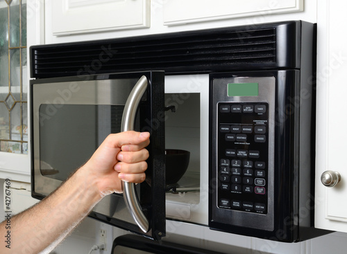 Slika na platnu Hand Opening Microwave