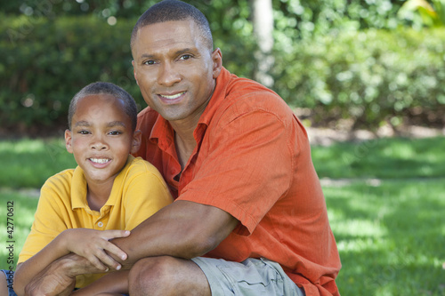 Happy African American Father and Son Family Outside © spotmatikphoto