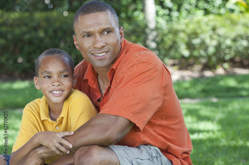 Happy African American Father and Son Family Outside © spotmatikphoto