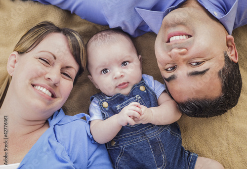 Mixed Race Family Playing on the Blanket