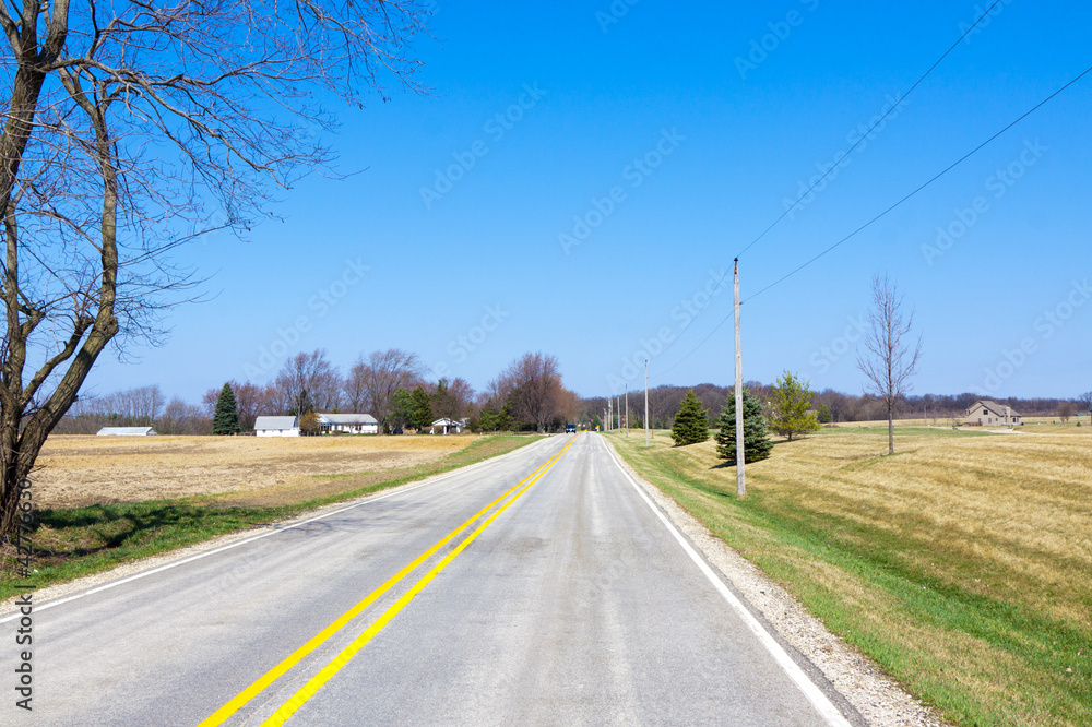 Fototapeta premium American Country Road With Blue Sky