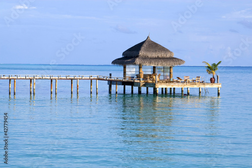 Pathway to a watercafe facing the ocean in Maldives