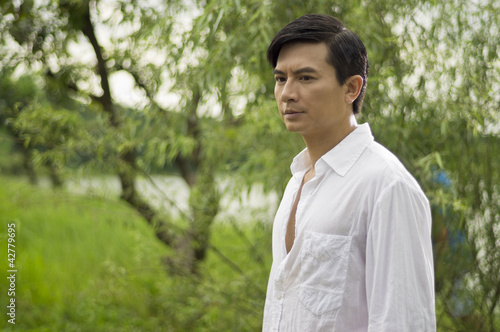 man under green tree