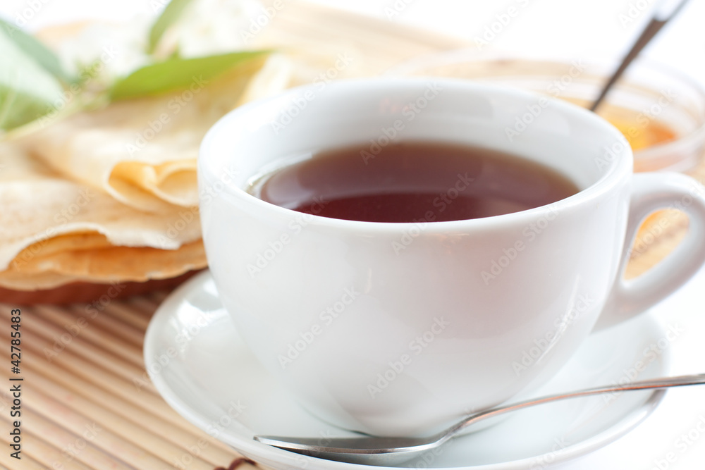 White cup of fragrant tea White cup of fragrant tea