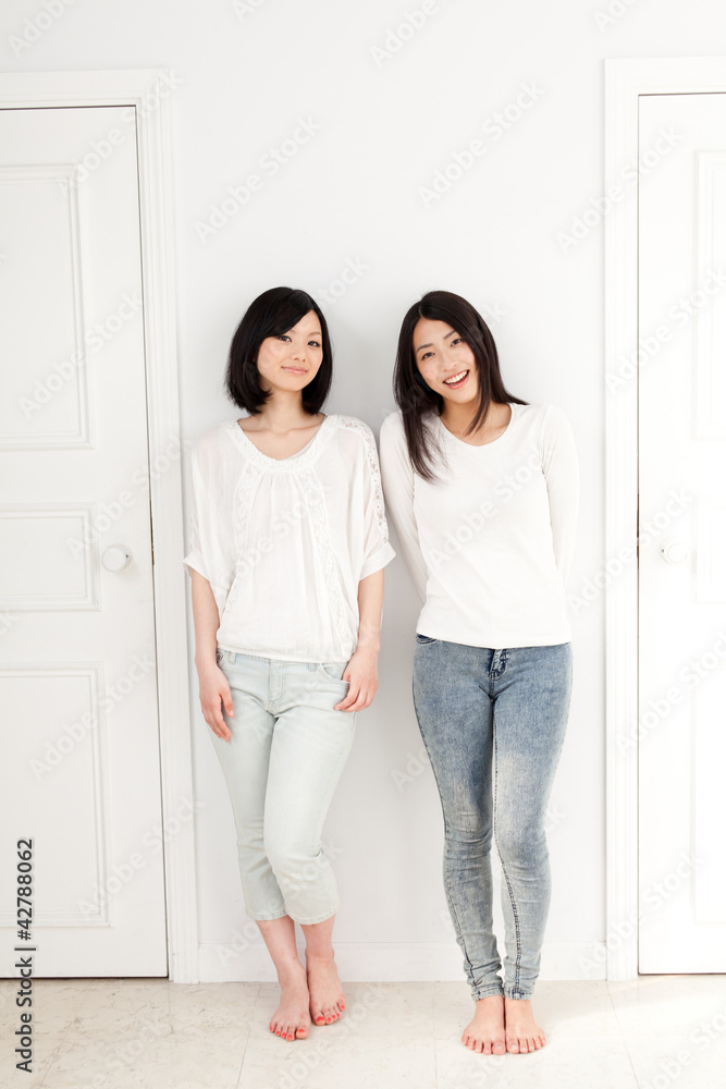 a young asian women with 2 doors a young asian women with 2 doors