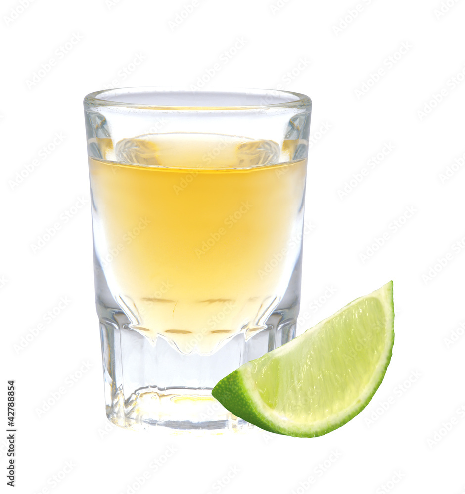 Glass of vodka with pepper and lime slice isolated on white Glass of vodka with pepper and lime slice isolated on white