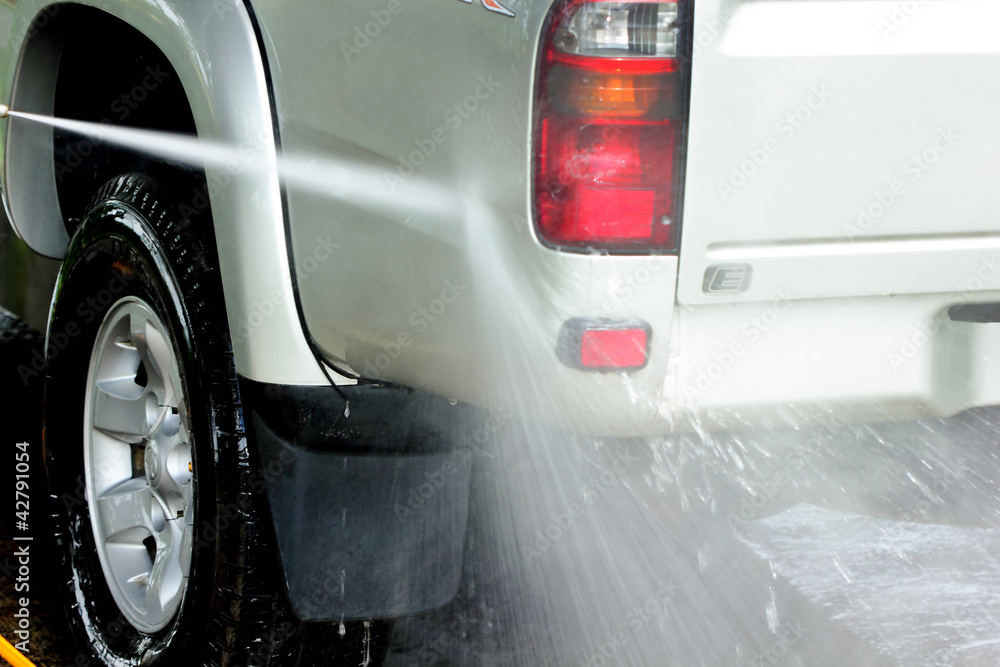 Fototapeta premium Car wash with high pressure water