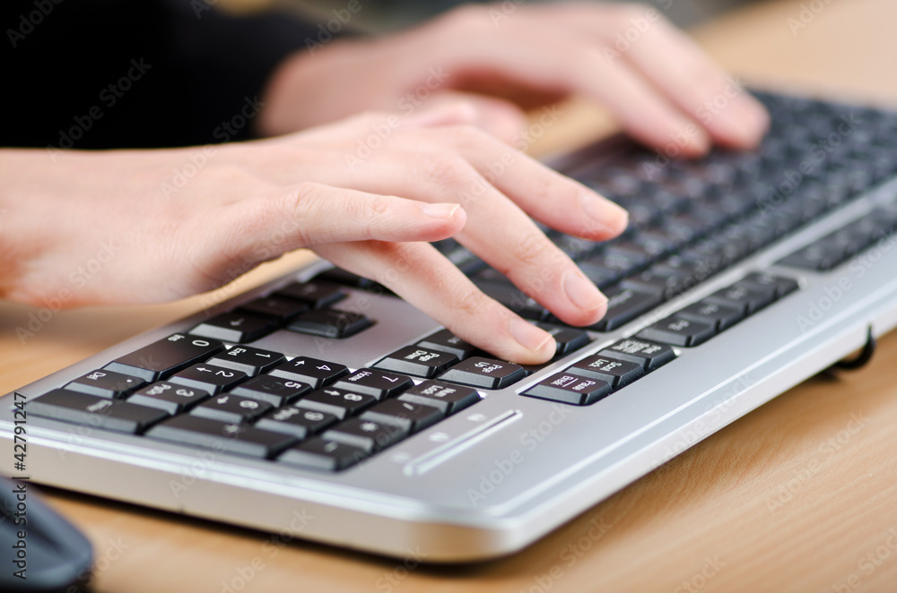 Hands typing on the keyboard Hands typing on the keyboard