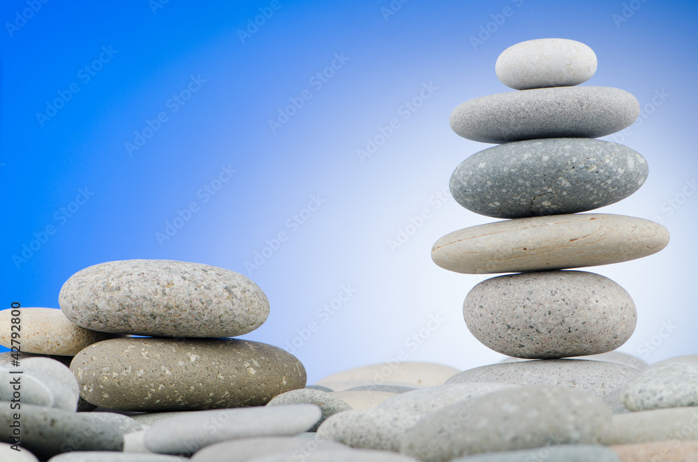 Pebbles stack against gradient background Pebbles stack against gradient background