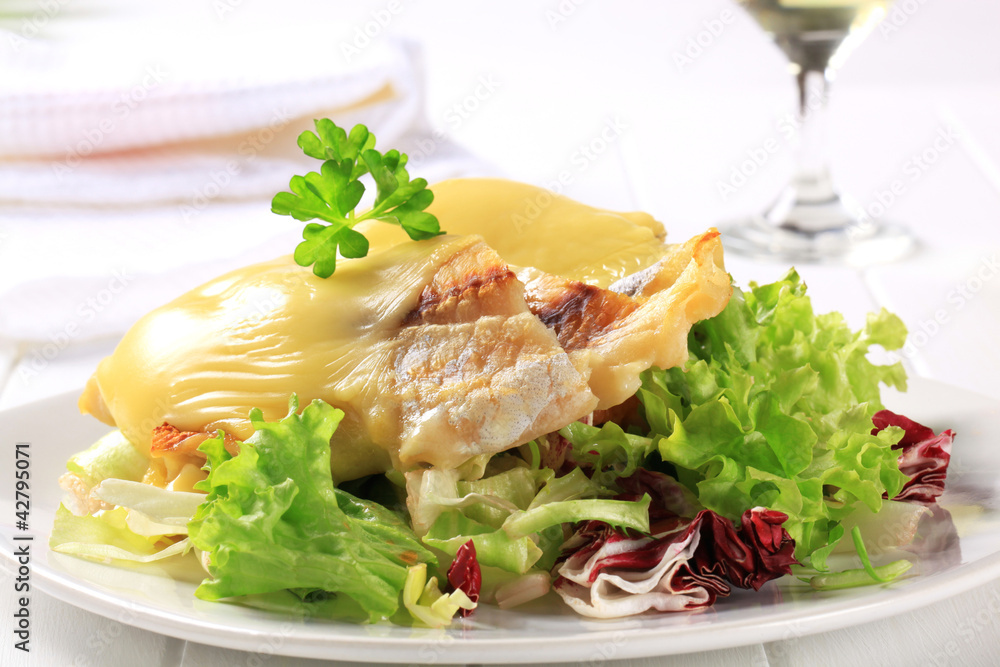 Cheese topped fish fillets with salad Cheese topped fish fillets with salad