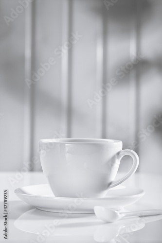 Wallpaper Mural ceramic coffee cup with spoon on white Torontodigital.ca