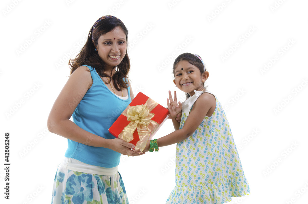 Little Asian girl giving gift for mother Little Asian girl giving gift for mother