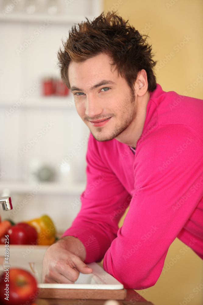Young man in a kitchen Young man in a kitchen