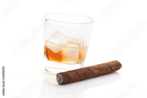 Whiskey and cigar on white.